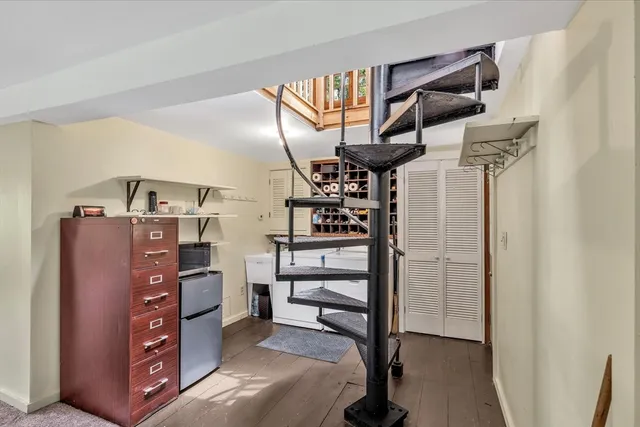 a porch with a table and chairs