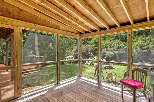 a room with wooden floor and furniture