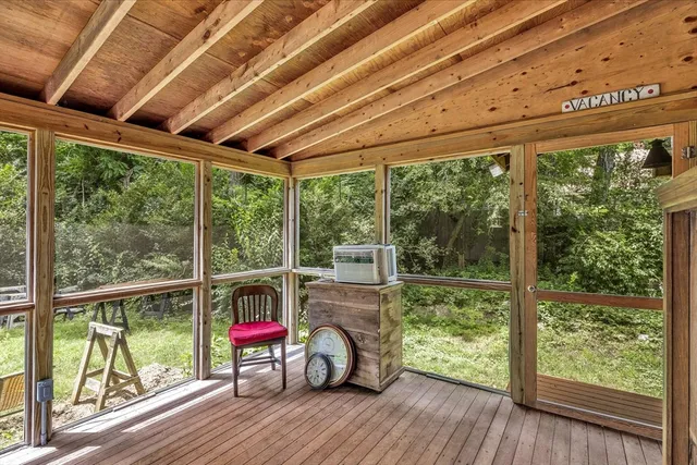 a view of a deck with wooden floor and outdoor space