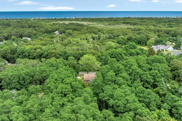 a view of a green field with an outdoor space