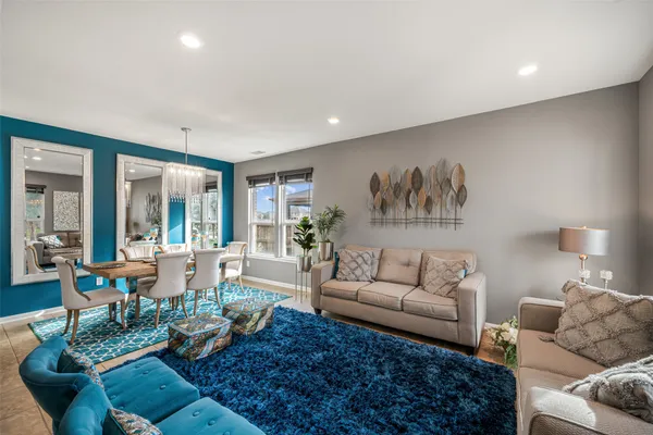 a living room with furniture or couch and a large window
