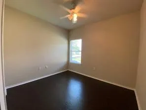 a view of room with window and ceiling fan