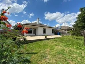 a front view of house with garden