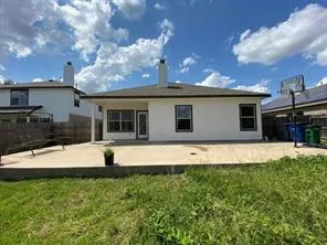 a house with swimming pool in front of it