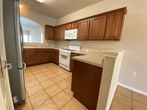 a kitchen with stainless steel appliances a sink stove and cabinets