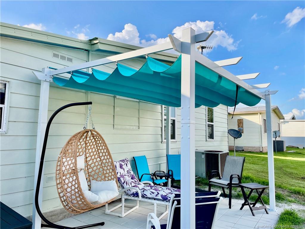 14513 Southwest Rake Drive Indiantown, FL 34956 - Photo 12 of 32 10' x 13' patio w/pergola