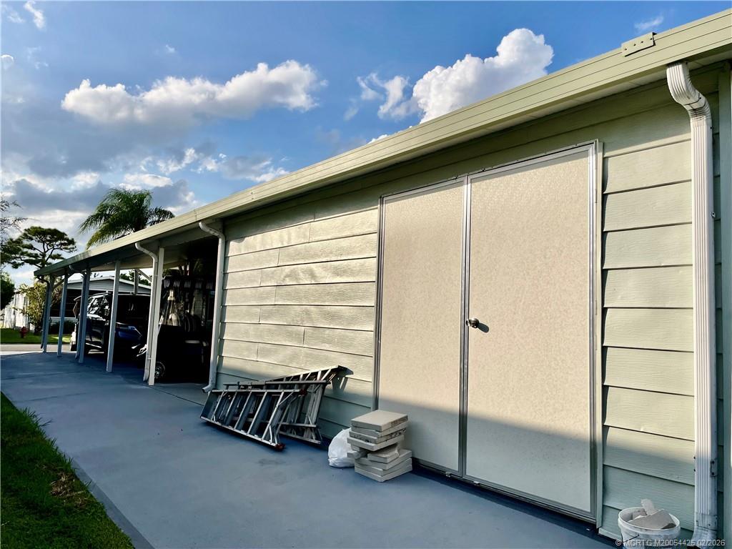 14513 Southwest Rake Drive Indiantown, FL 34956 - Photo 30 of 32 Shed with 2 sets of doorways. New doors 2023