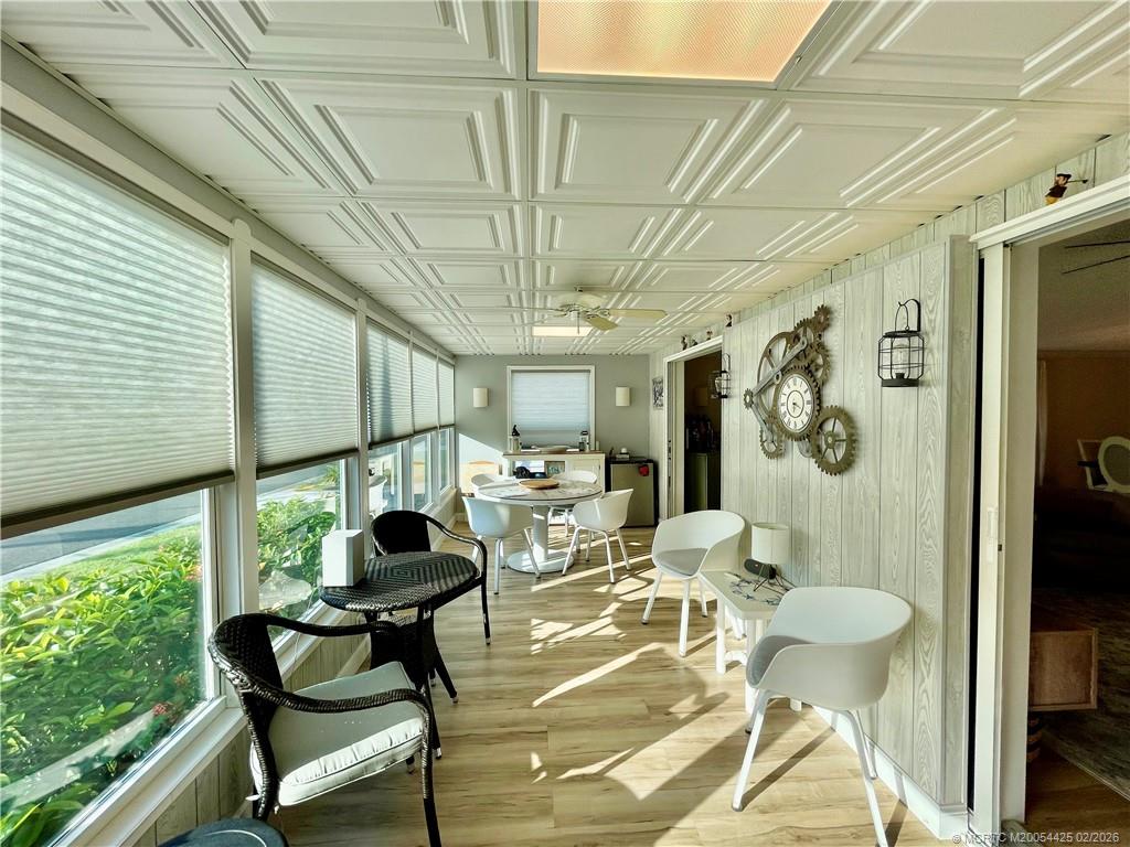 14513 Southwest Rake Drive Indiantown, FL 34956 - Photo 3 of 32 Vinyl floors, custom accordion shades, 12" insulation, 4 1/2" base baords, A/C unit & 2 pocket doors