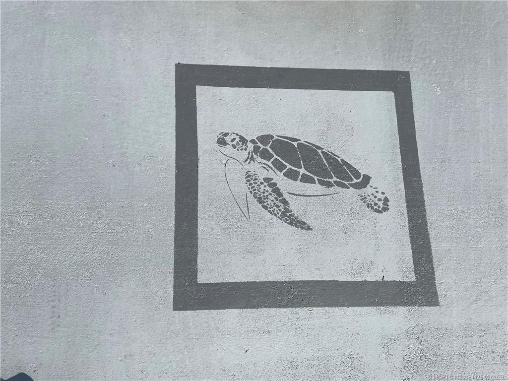 14513 Southwest Rake Drive Indiantown, FL 34956 - Photo 32 of 32 Painted driveway with stenciled design.