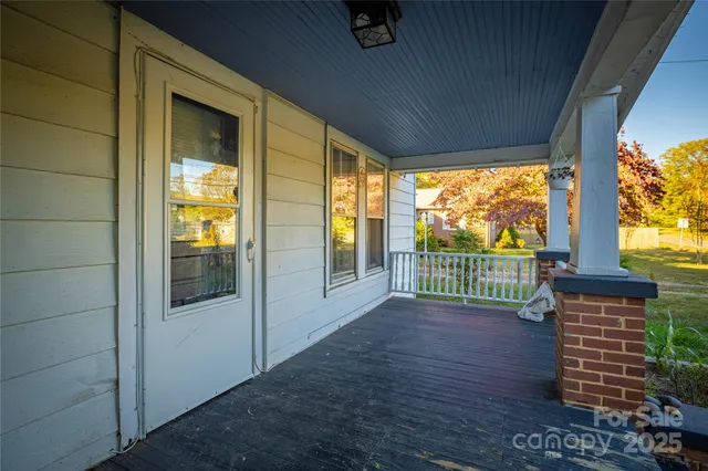 a view of a porch with wooden floor and outdoor space