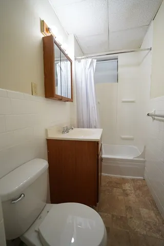 a bathroom with a sink a toilet and a bathtub