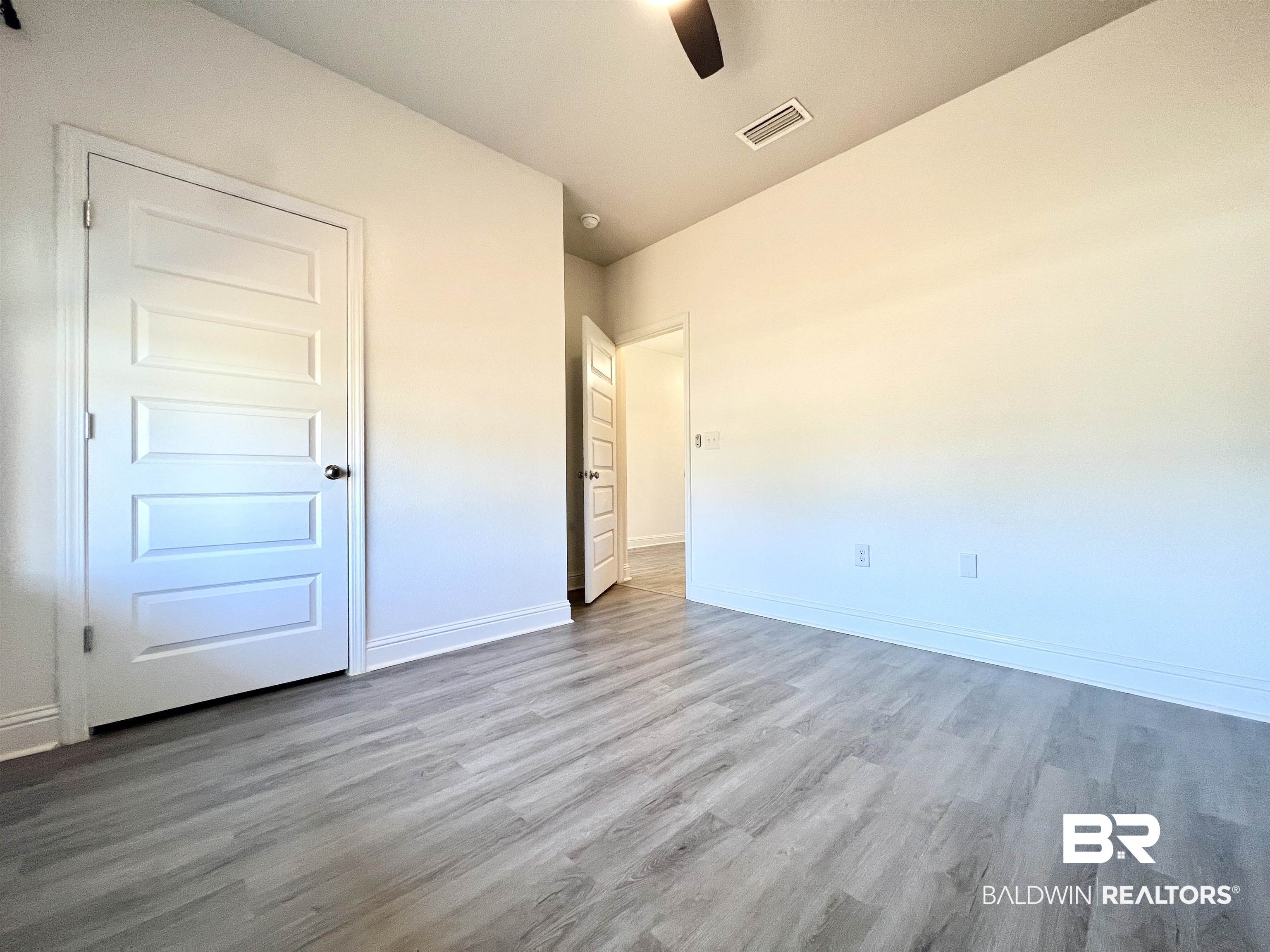 24785 Slater Mill Road Daphne, AL 36526 - Photo 13 of 46 Unfurnished bedroom featuring lofted ceiling, light hardwood / wood-style floors, and ceiling fan