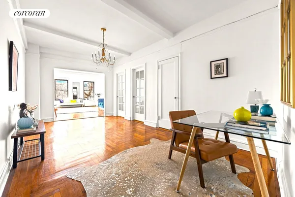 a living room with dining table and a couch