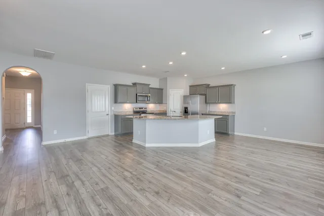 a view of kitchen with wooden floor