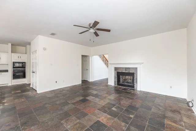 a view of an empty room with a fireplace