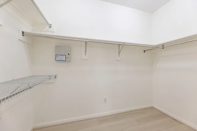 a view of a room with racks on the wall