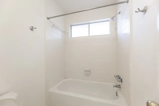 a close up of a bathtub curtain