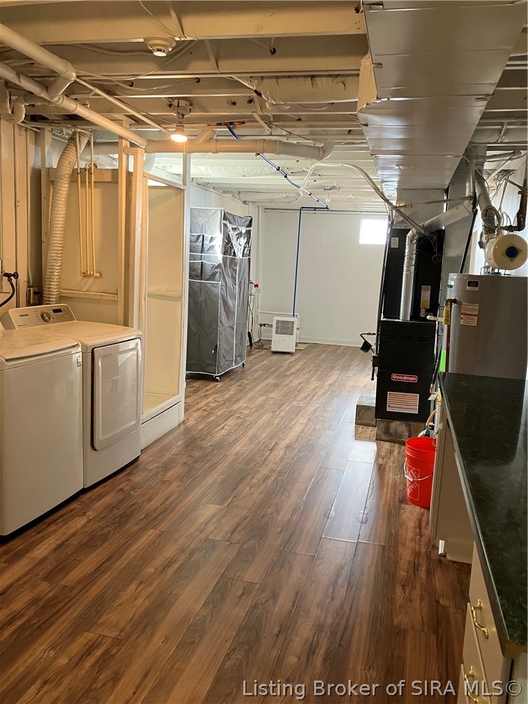 1801 Rita Drive New Albany, IN 47150 - Photo 27 of 37 Laundry hook ups, furnace, water heater, sump pump and sump back up plus gorgeous floors are in this room . The rec room and exercise room also have the wood gorgeous floors.
