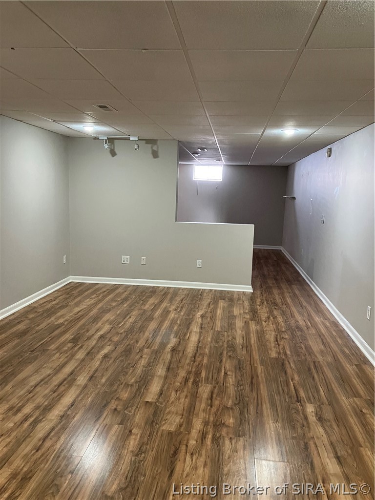 1801 Rita Drive New Albany, IN 47150 - Photo 29 of 37 This basement room large enough for rec tables, exercise equipment or just plain play are. Theree is another area behind the pony wall that could also be used for a multitude of reasons