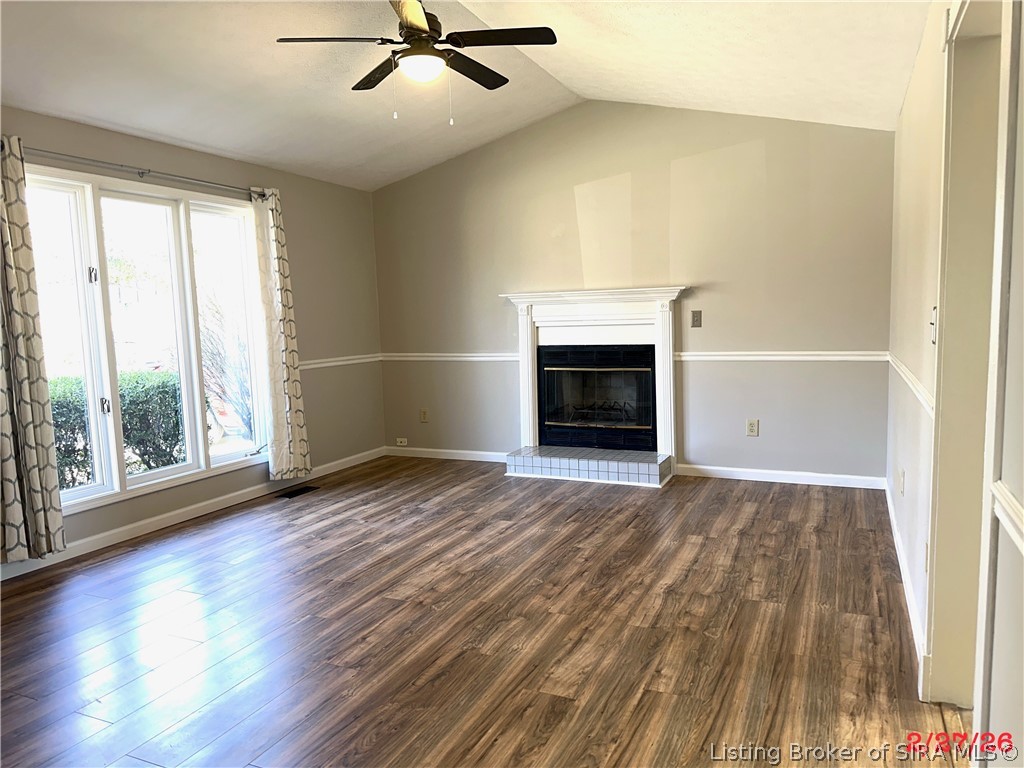 1801 Rita Drive New Albany, IN 47150 - Photo 4 of 37 Love, love, love this living room with wood burning fireplace, ceiling to floor windows and recent flooring.