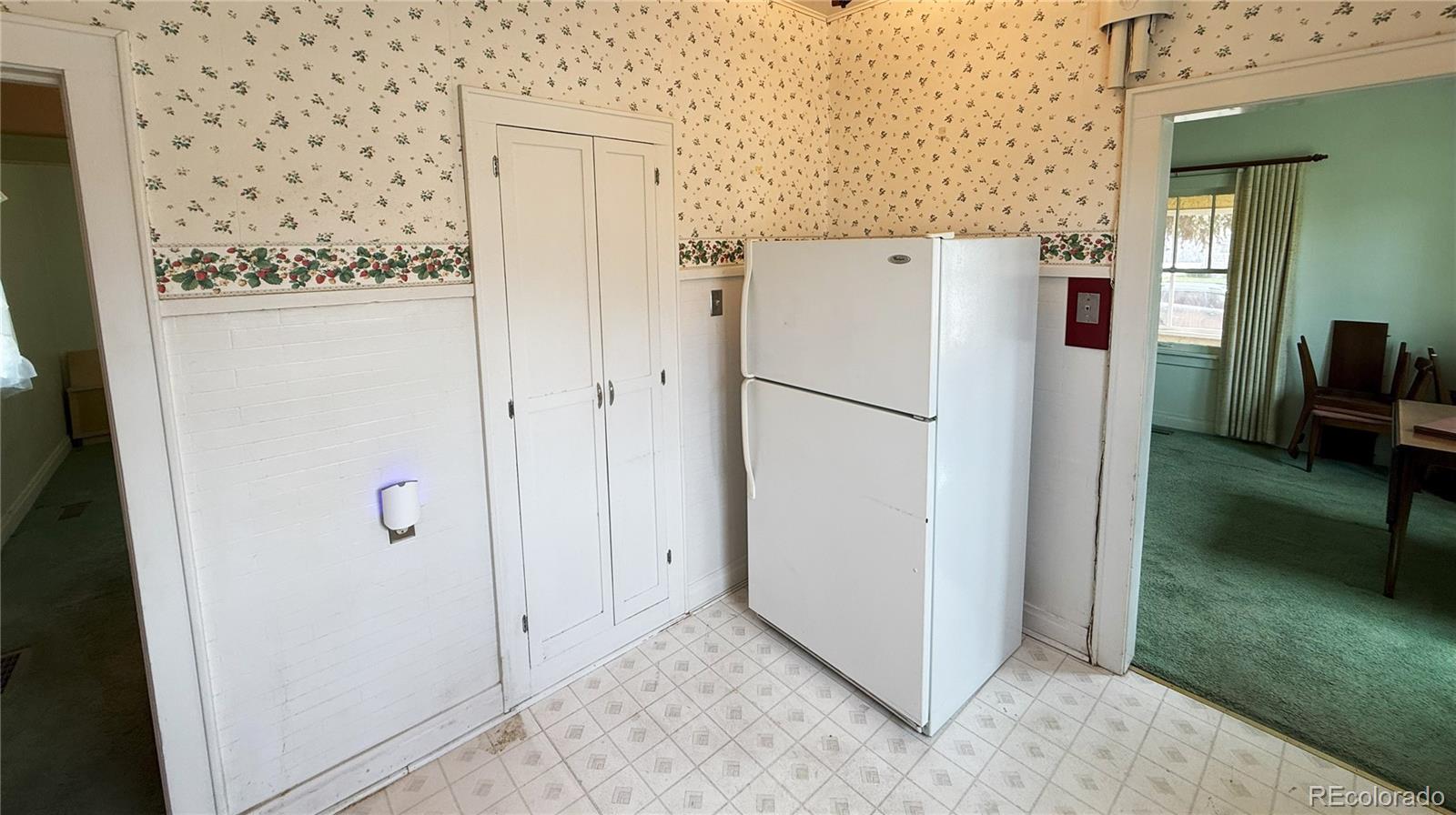 313 3rd Street Ovid, CO 80744 - Photo 12 of 21 a view of a refrigerator in kitchen with a refrigerator