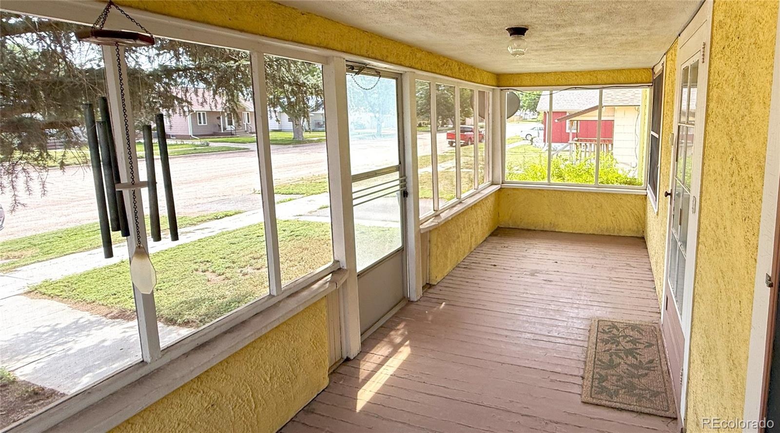 313 3rd Street Ovid, CO 80744 - Photo 5 of 21 a view of hallway with furniture and a large window