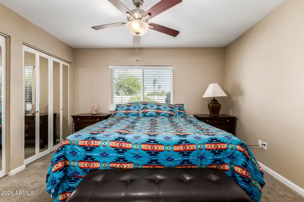 a bedroom with bed and window