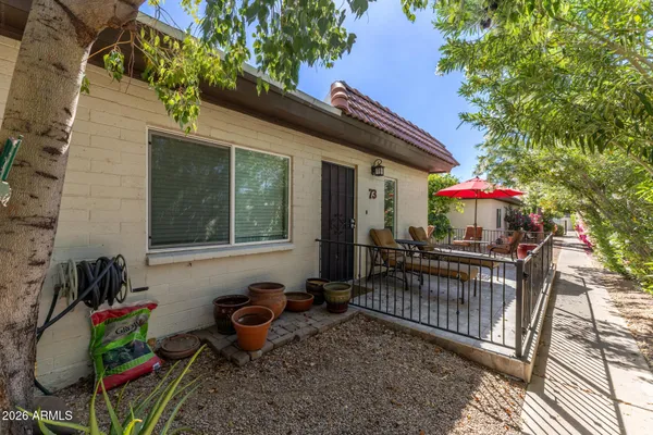 a view of a sitting area with furniture and garden