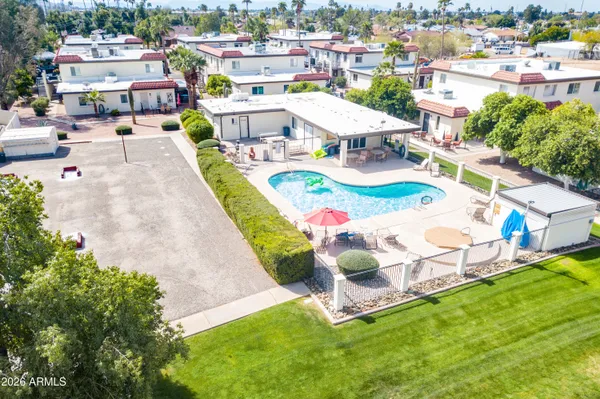 a view of yard and swimming pool