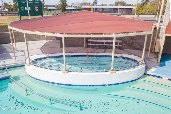 a view of a swimming pool with a patio