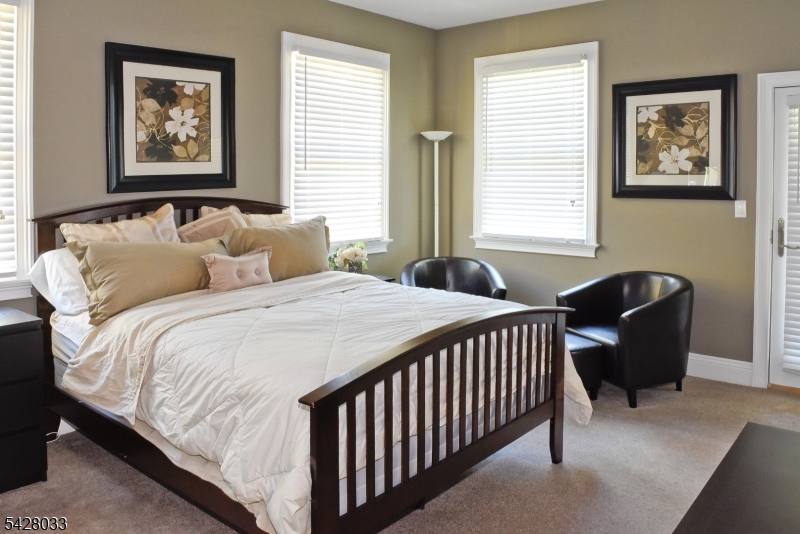2 Chilton Road Chester, NJ 07930 - Photo 13 of 43 a bedroom with a bed and a window with chair