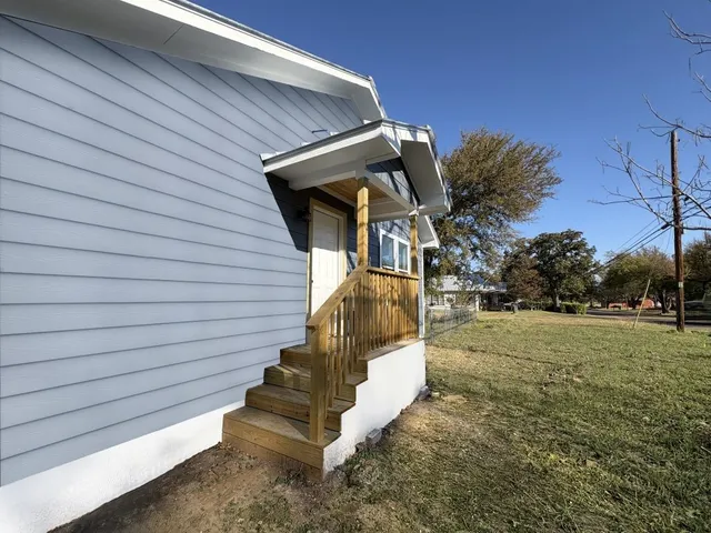 a view of backyard with green space