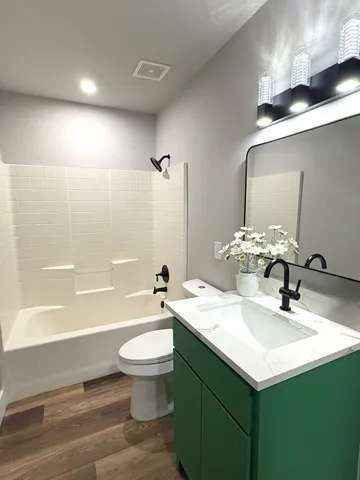 a bathroom with a sink a toilet and a bathtub