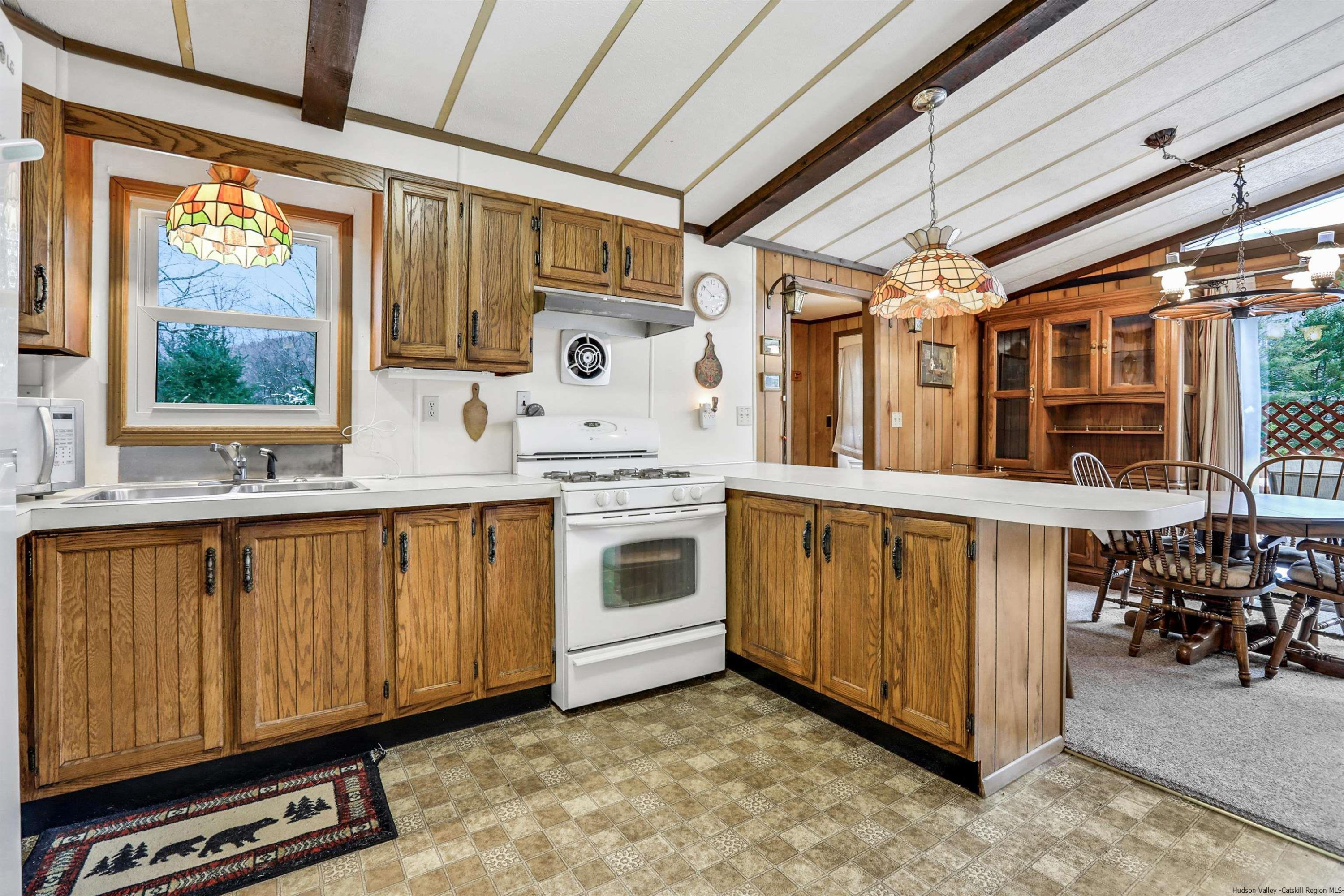 60 Grandview Acres Road Phoenicia, NY 12464 - Photo 12 of 21 a utility room with stainless steel appliances wooden cabinets and a stove