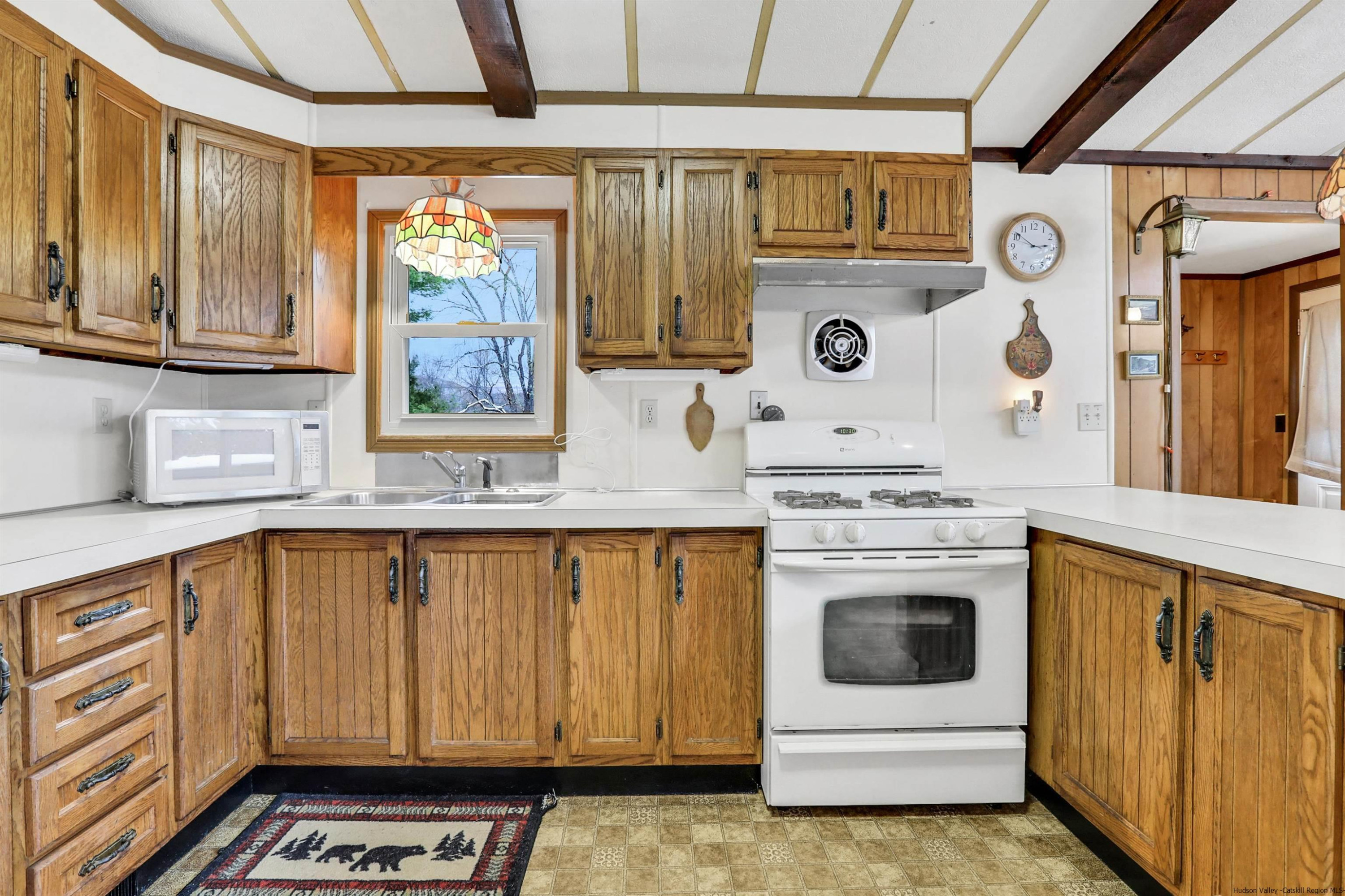 60 Grandview Acres Road Phoenicia, NY 12464 - Photo 13 of 21 a kitchen with stainless steel appliances granite countertop a stove and a refrigerator