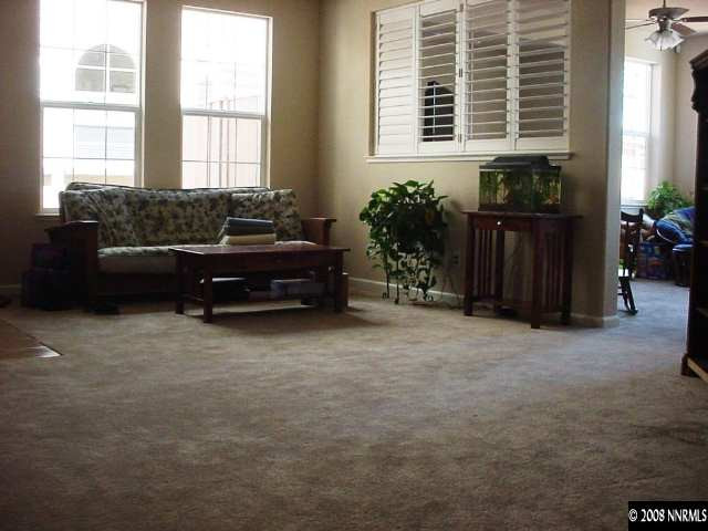 1791 A Wind Ranch Road Reno, NV 89521 - Photo 5 of 9 a living room with furniture and potted plants