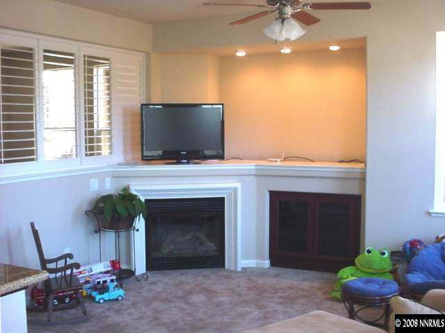1791 A Wind Ranch Road Reno, NV 89521 - Photo 6 of 9 a living room with furniture and a fireplace