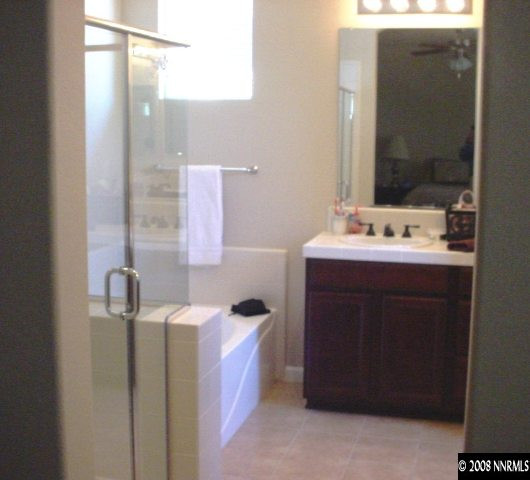 1791 A Wind Ranch Road Reno, NV 89521 - Photo 8 of 9 a bathroom with a sink and a mirror