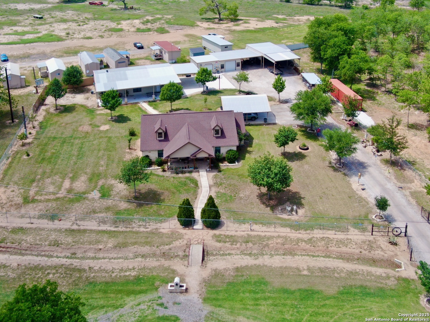 an aerial view of house with yard