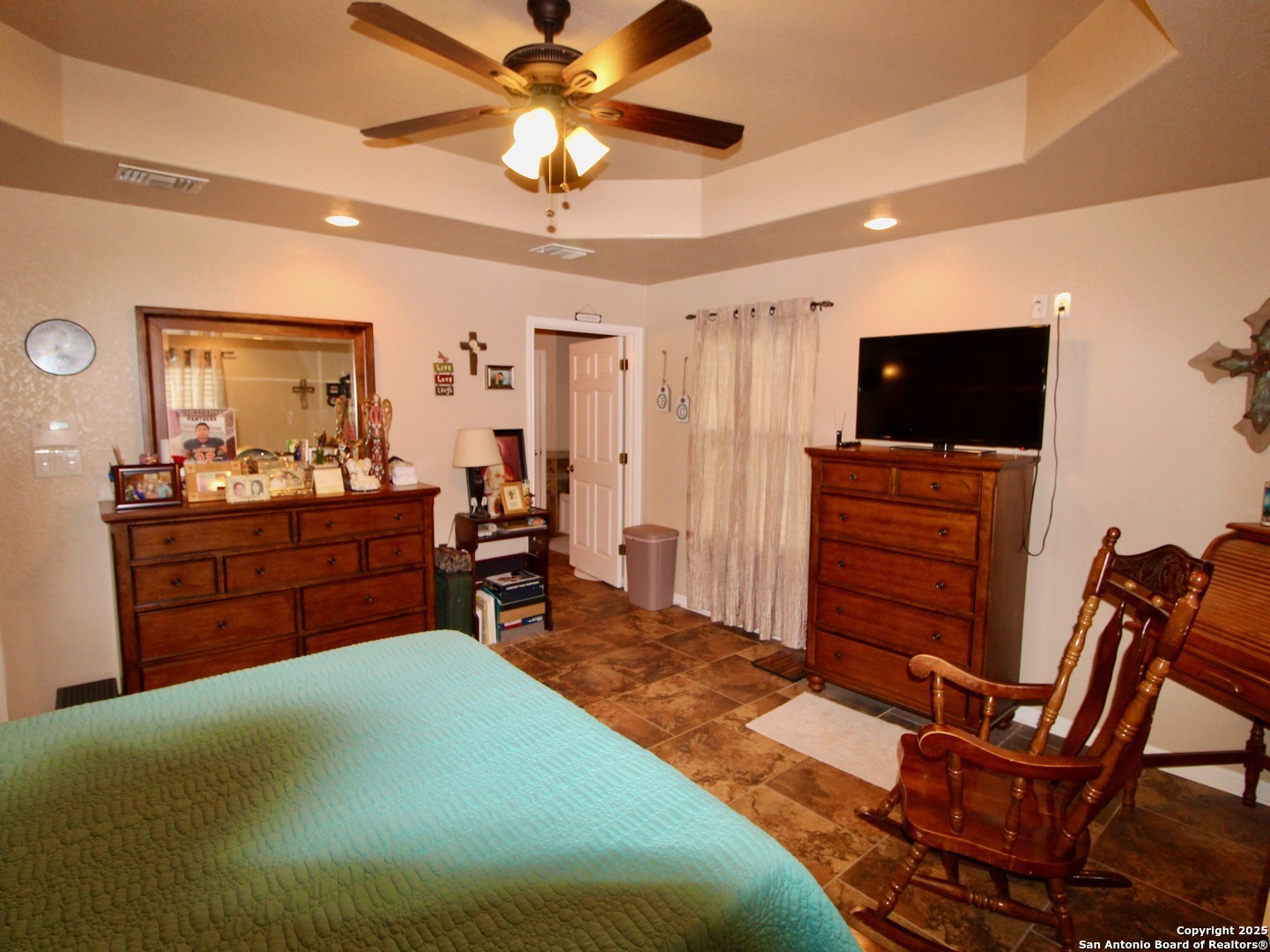 12365 Rudolph Road, Unit 3 Atascosa, TX 78002 - Photo 11 of 42 a bedroom with furniture and a flat screen tv