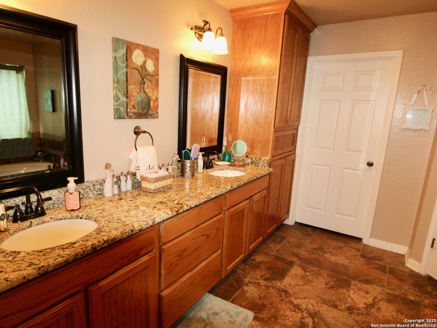 12365 Rudolph Road, Unit 3 Atascosa, TX 78002 - Photo 12 of 42 a bathroom with a granite countertop double vanity sink and a mirror