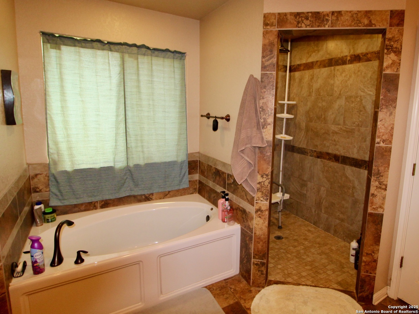12365 Rudolph Road, Unit 3 Atascosa, TX 78002 - Photo 14 of 42 a bathroom with a tub and a shower