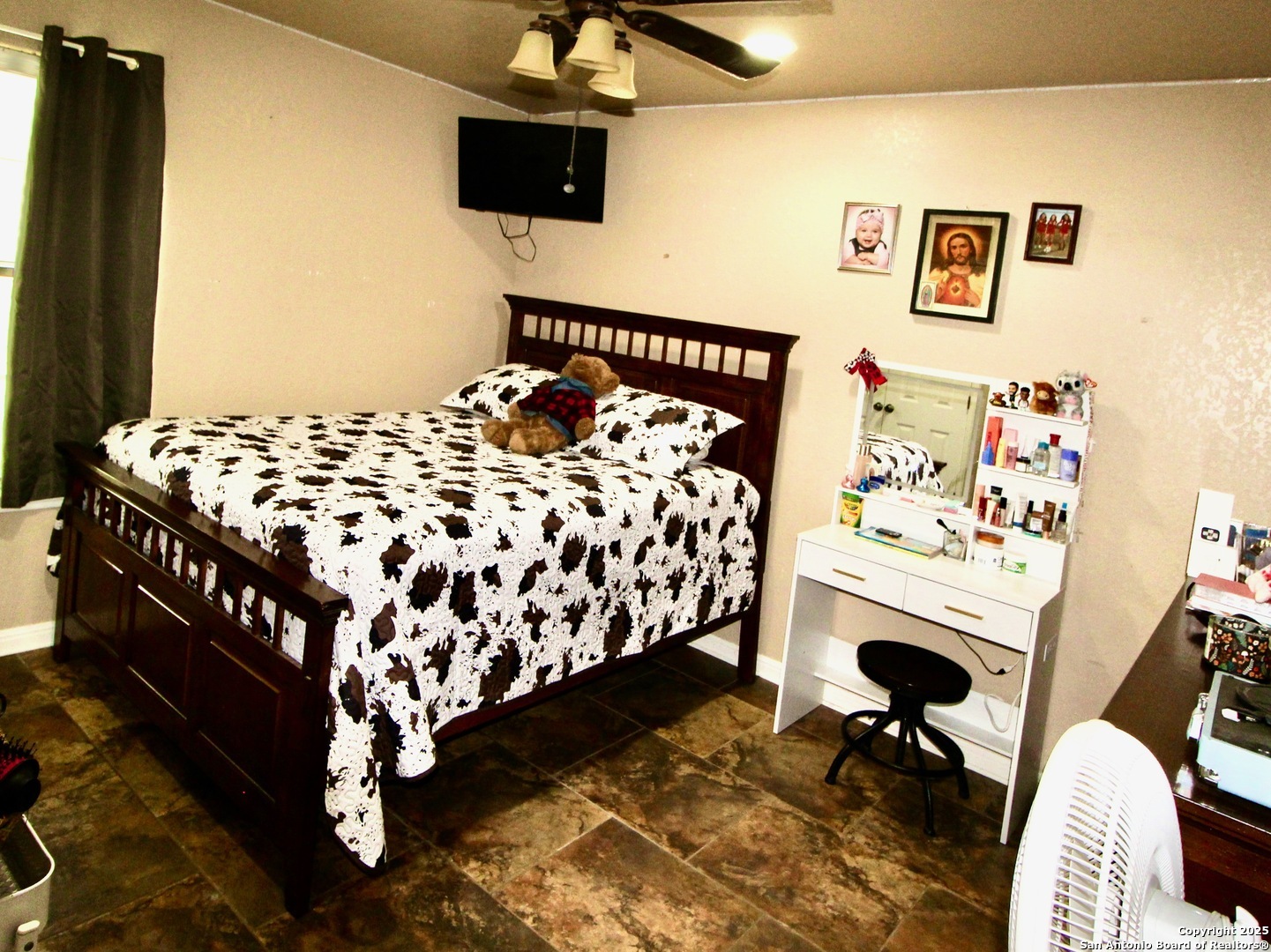 12365 Rudolph Road, Unit 3 Atascosa, TX 78002 - Photo 15 of 42 a bedroom with a bed and a chair