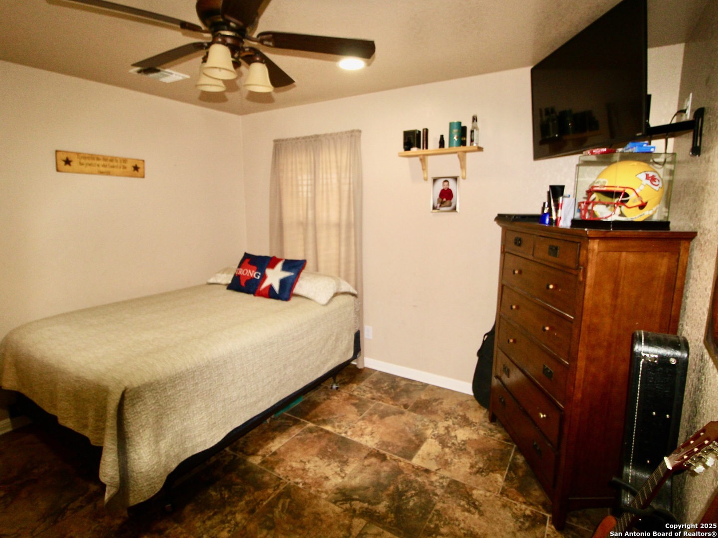 12365 Rudolph Road, Unit 3 Atascosa, TX 78002 - Photo 16 of 42 a bedroom with a bed and flat tv screen