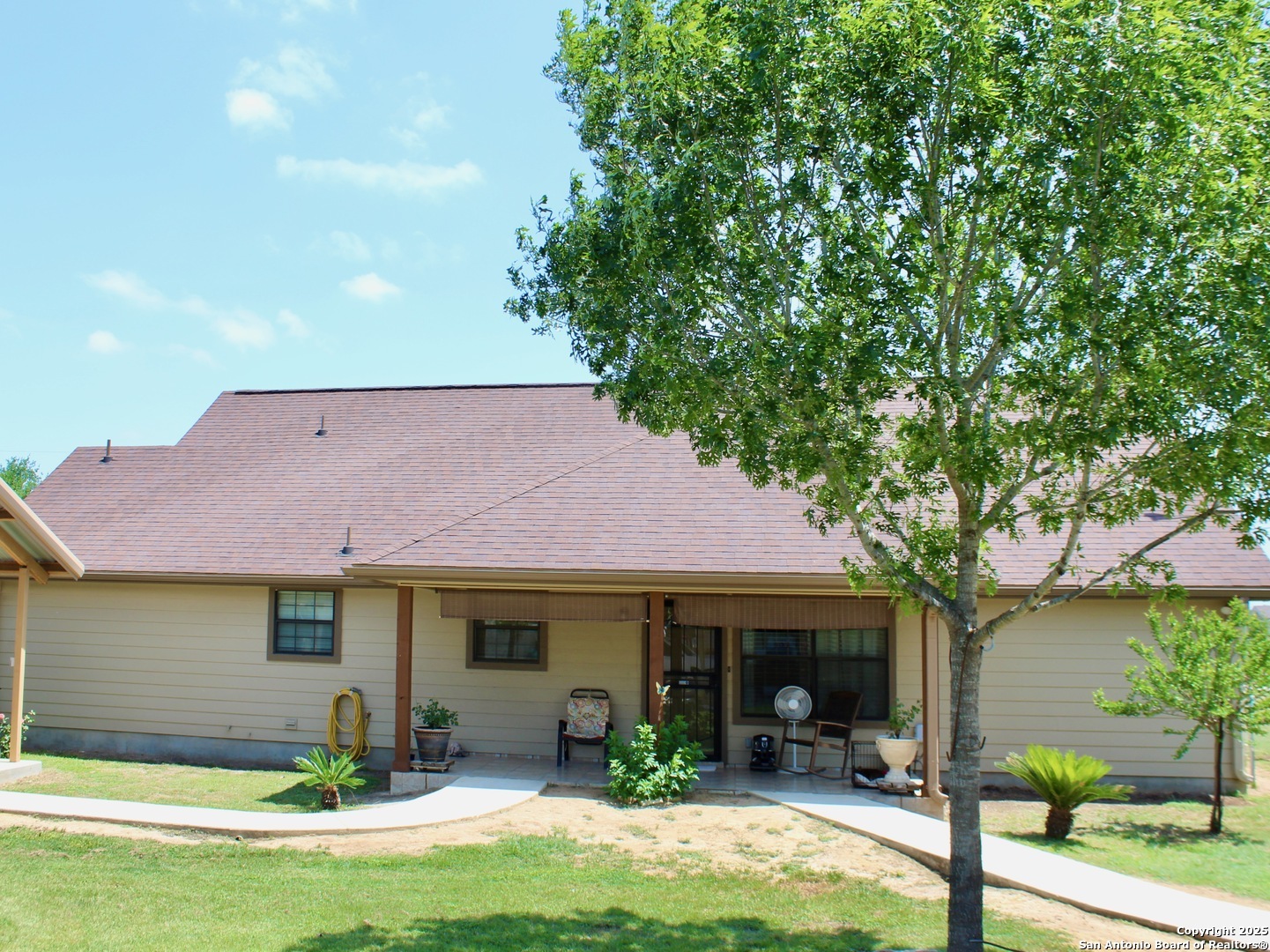 12365 Rudolph Road, Unit 3 Atascosa, TX 78002 - Photo 18 of 42 a front view of a house with yard and porch