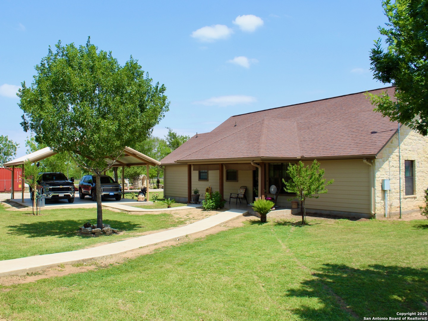 12365 Rudolph Road, Unit 3 Atascosa, TX 78002 - Photo 19 of 42 a view of a house with a yard porch and sitting area