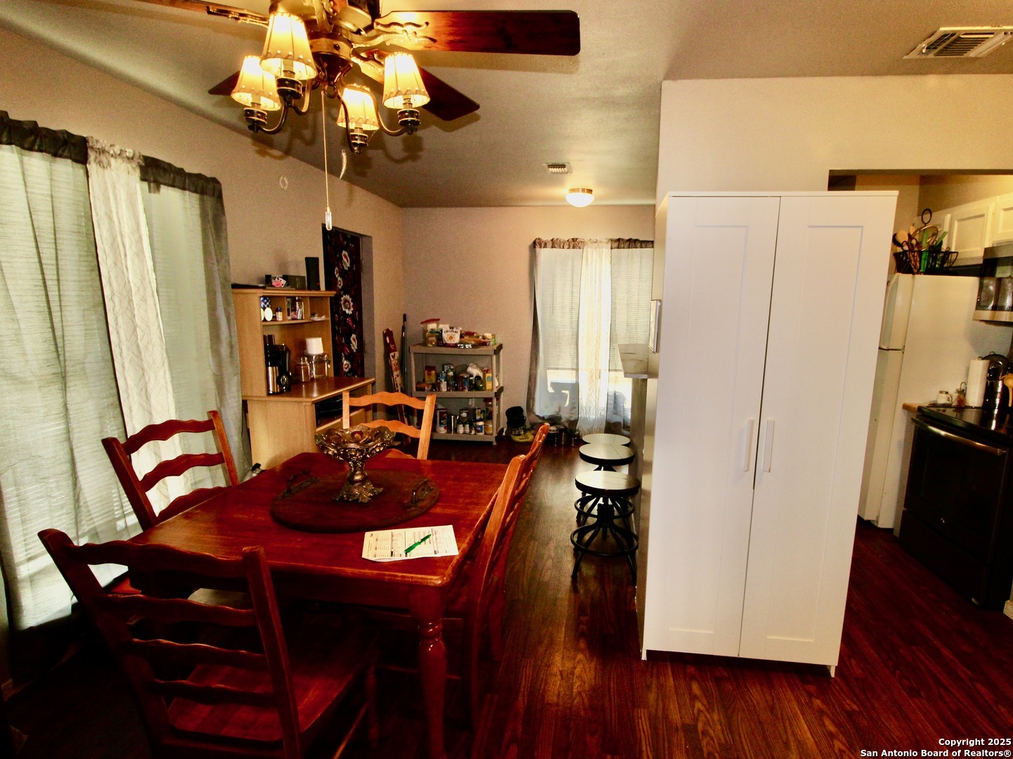 12365 Rudolph Road, Unit 3 Atascosa, TX 78002 - Photo 22 of 42 a view of a dining room with furniture and wooden floor