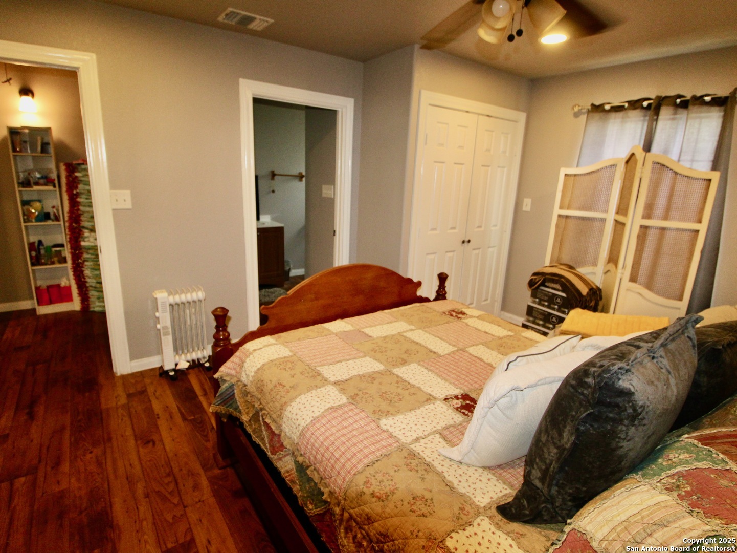12365 Rudolph Road, Unit 3 Atascosa, TX 78002 - Photo 25 of 42 a bedroom with a bed and a mirror