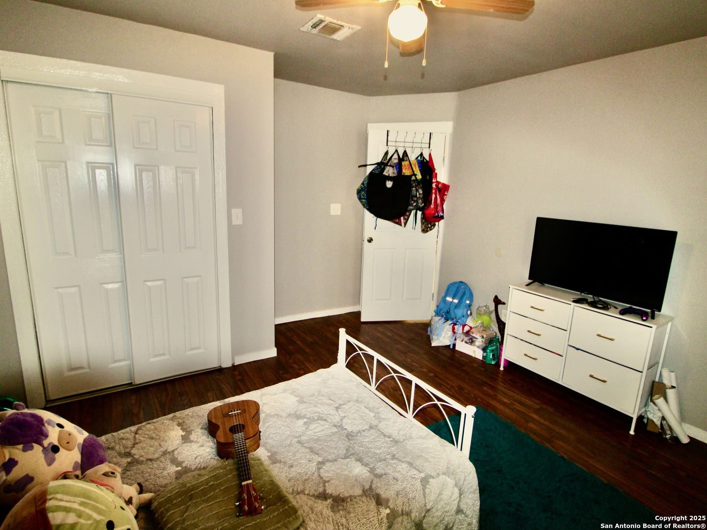 12365 Rudolph Road, Unit 3 Atascosa, TX 78002 - Photo 29 of 42 a bedroom with a bed and a flat screen tv