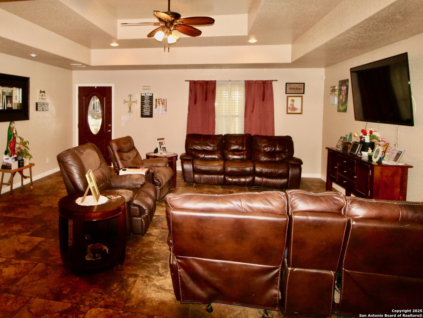 12365 Rudolph Road, Unit 3 Atascosa, TX 78002 - Photo 4 of 42 a living room with furniture a flat screen tv and gym equipment